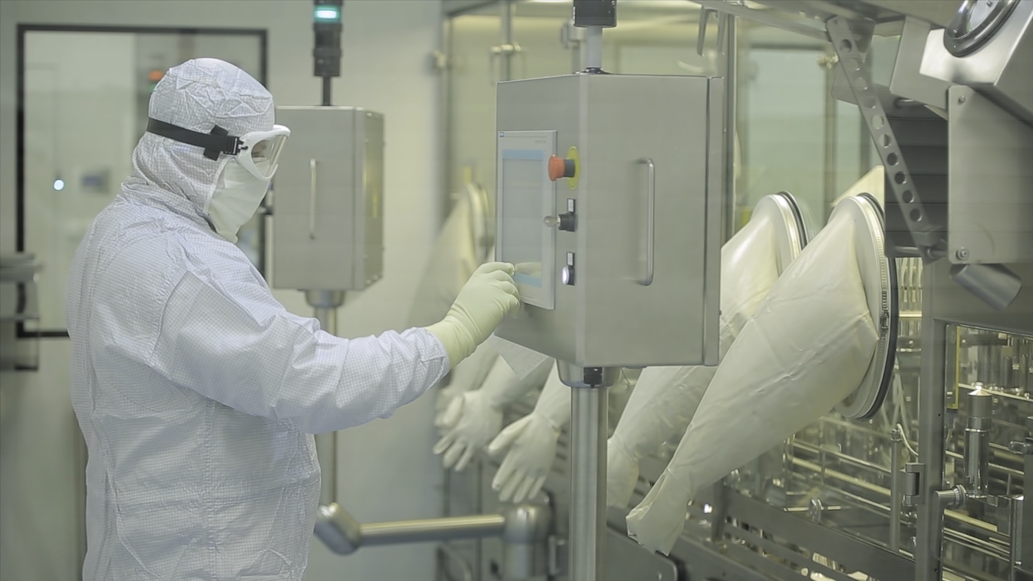 A Pharmaceutical Production Line Worker In A Fixed Cleanroom With Dycem Contamination Control Mats